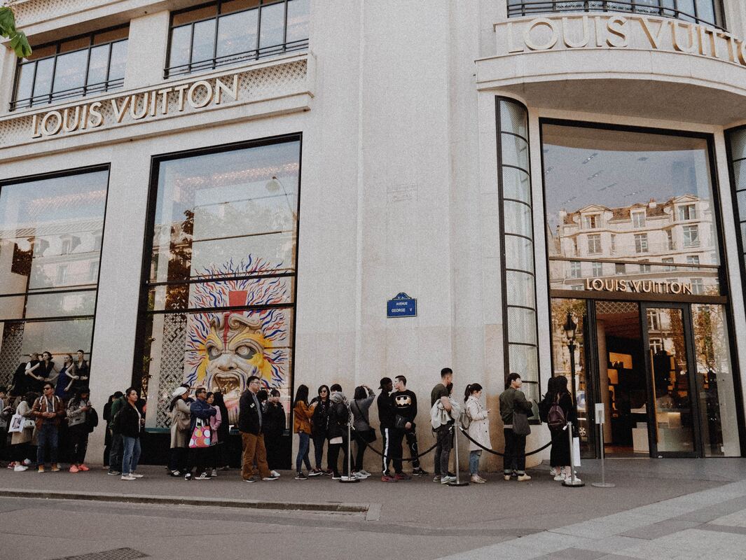 Louis Vuitton Store On Avenue Des Champselysees And People Waiting